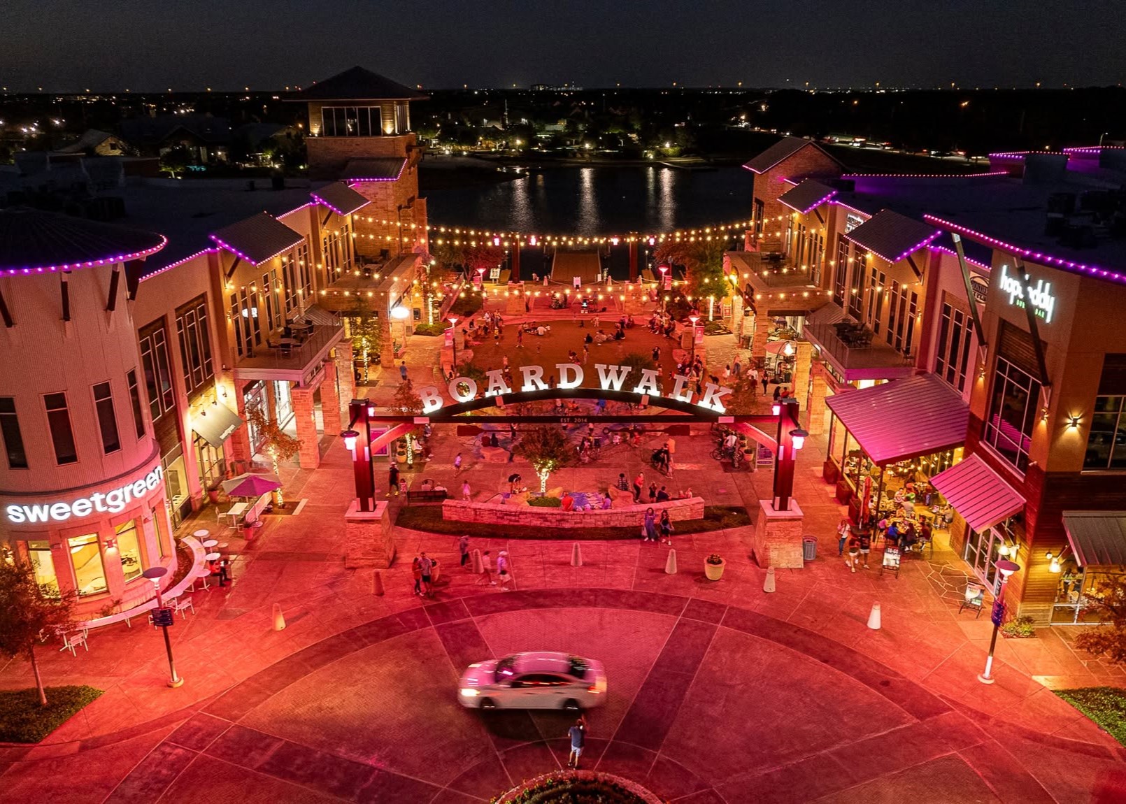 Guests supporting breast cancer awareness during Boardwalk Goes Pink with Houston Methodist at The Boardwalk Towne Lake.
