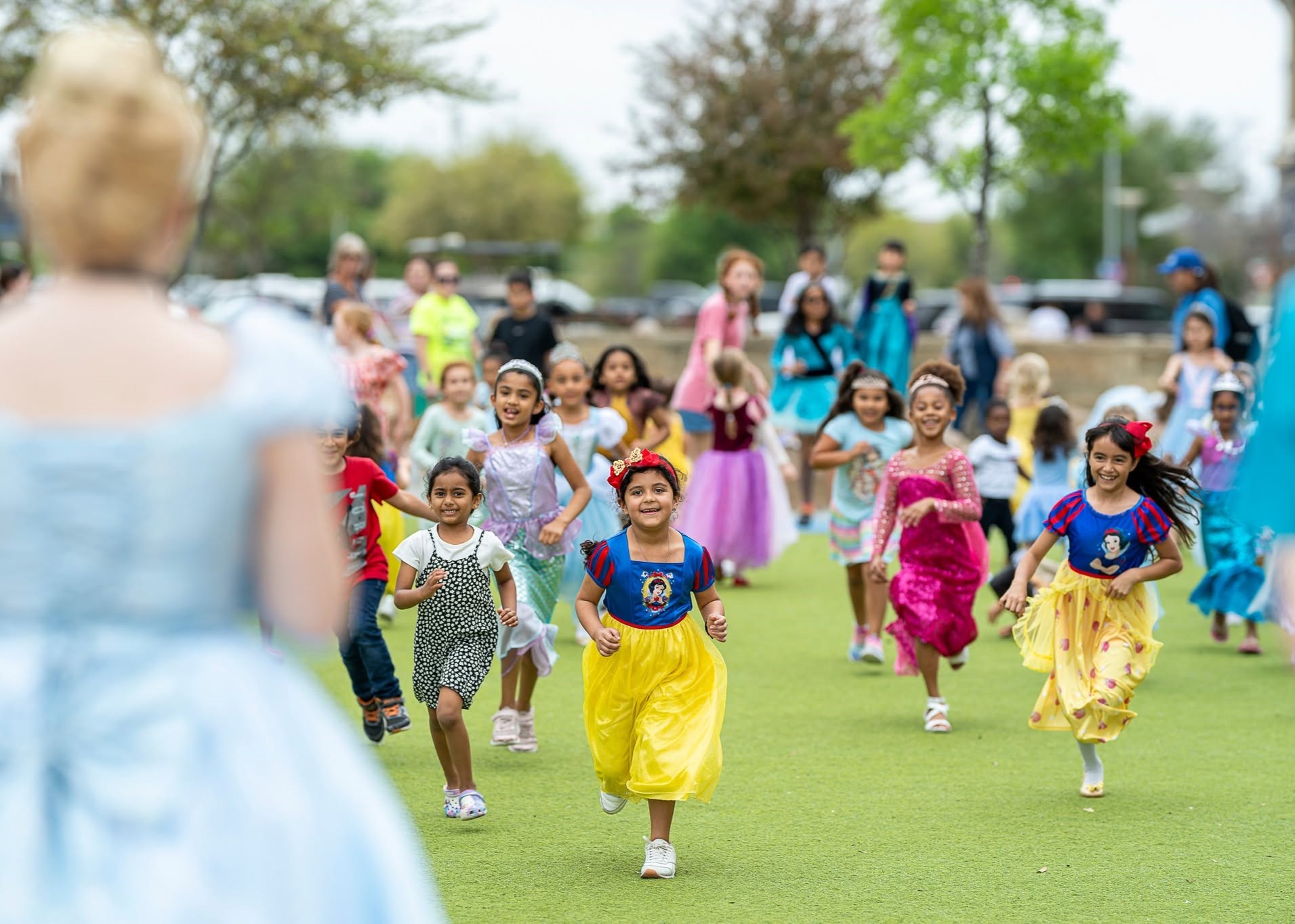 Children enjoying Princess Story Time during a family event at The Boardwalk Towne Lake.