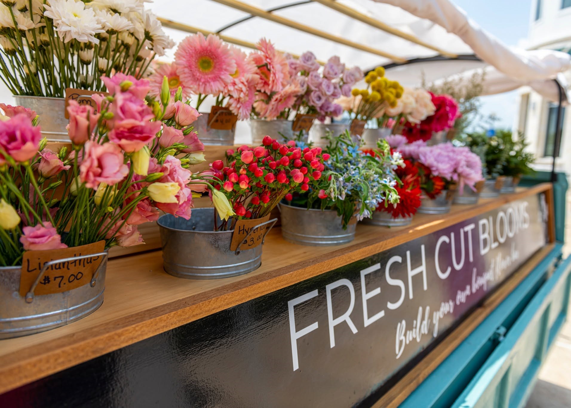 Colorful Flower Truck display bringing spring blooms to guests at The Boardwalk Towne Lake.