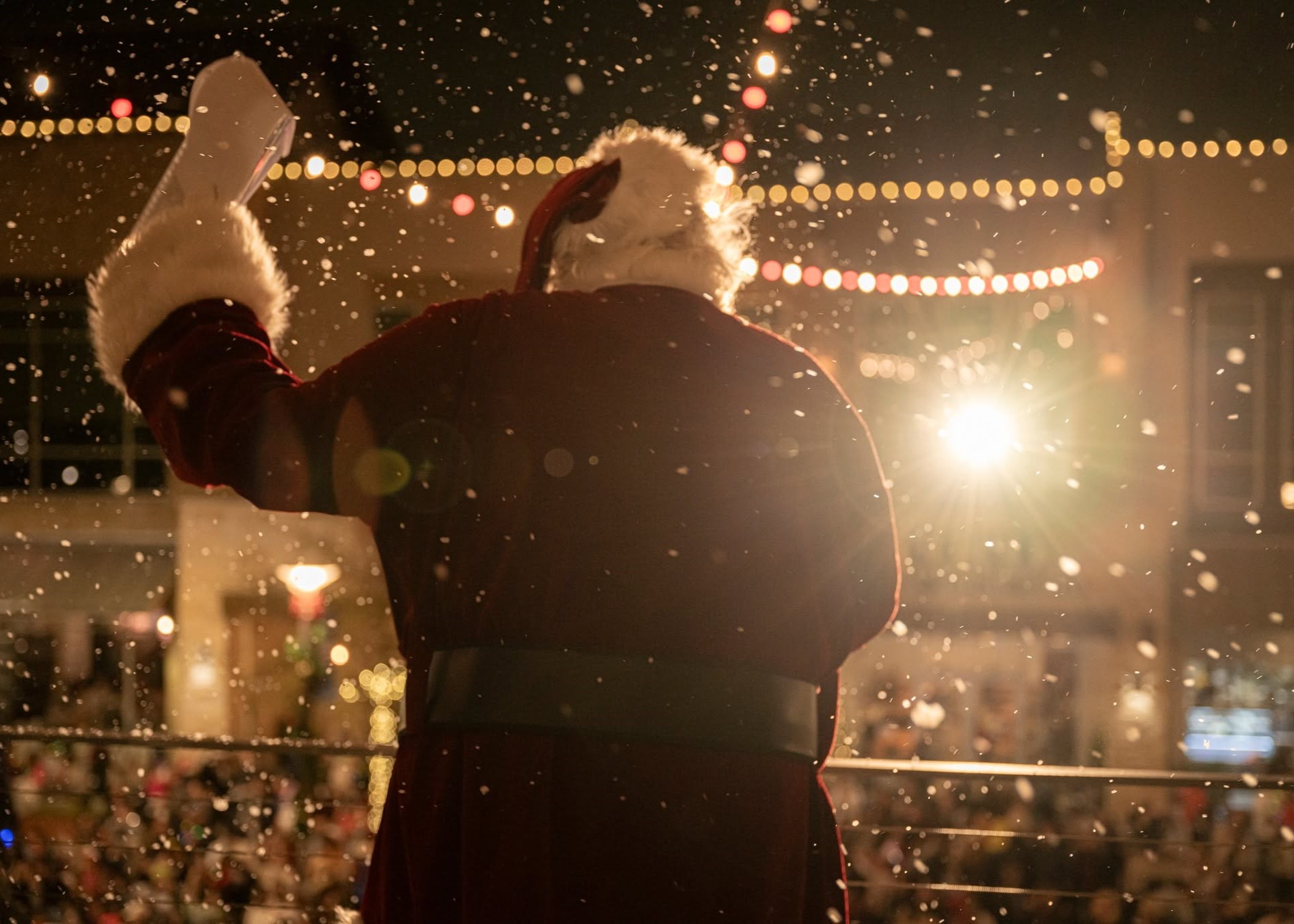 Children visiting Santa Claus during the annual Light the Towne holiday celebration at The Boardwalk Towne Lake.