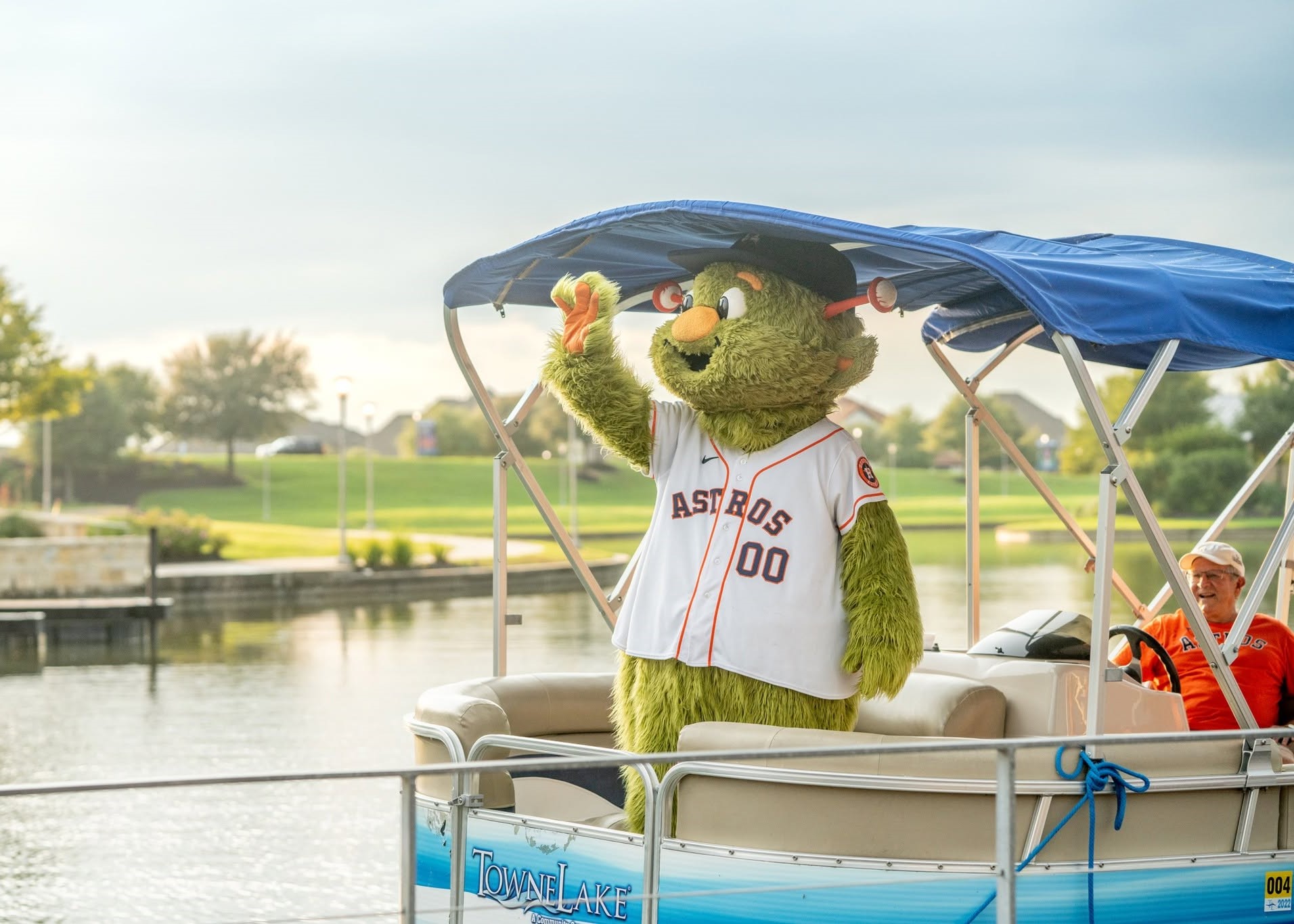 Houston Astros mascot Orbit greeting families during a community event at The Boardwalk Towne Lake.