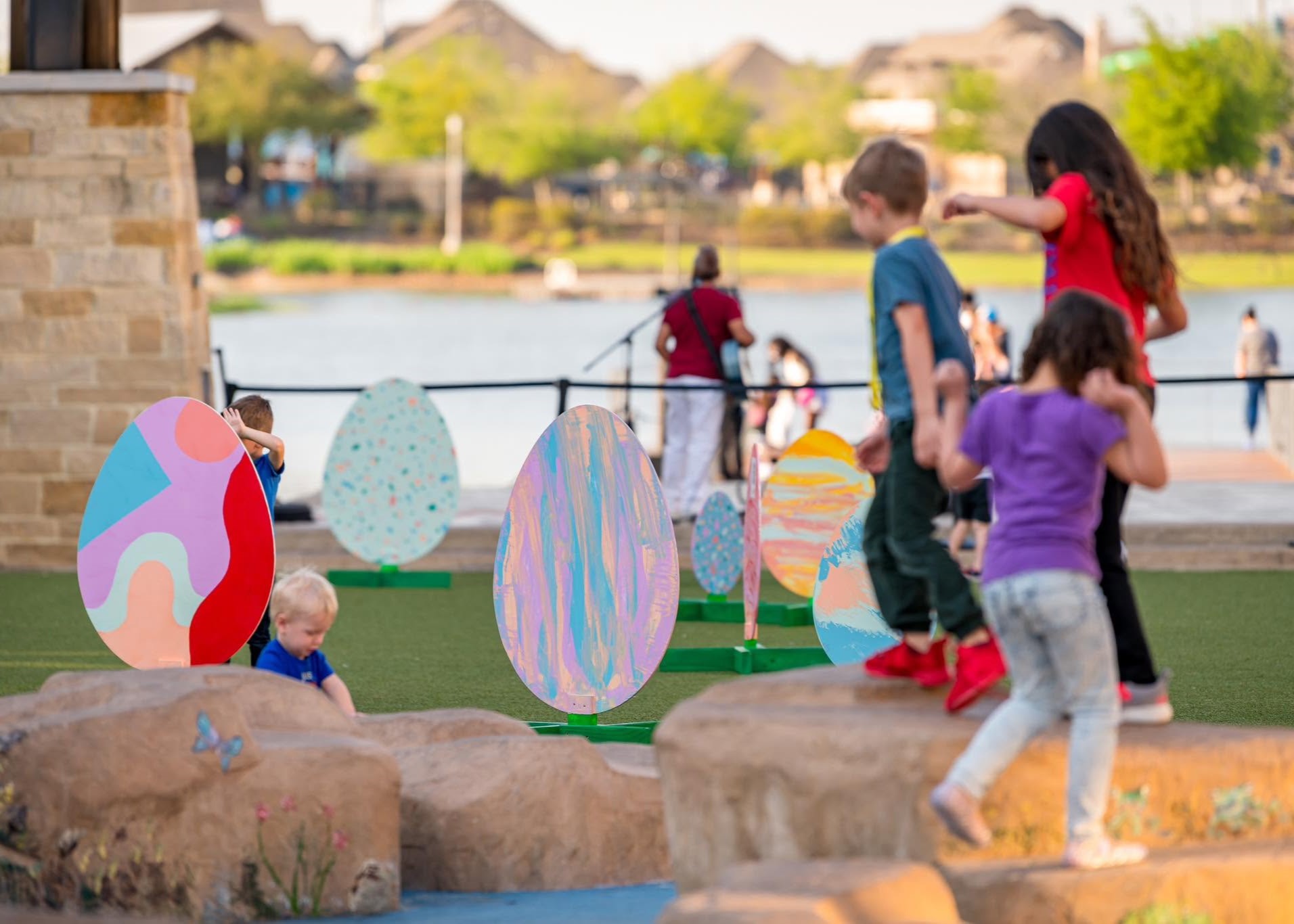 Children participating in the Easter Egg Hunt at The Boardwalk Towne Lake in Cypress, Texas.